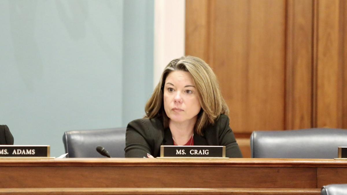 Rep. Craig sitting at dias