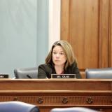 Rep. Craig sitting at dias