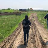 Rep Angie Craig walking with farmer